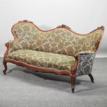 A Victorian style green upholstered show frame sofa,