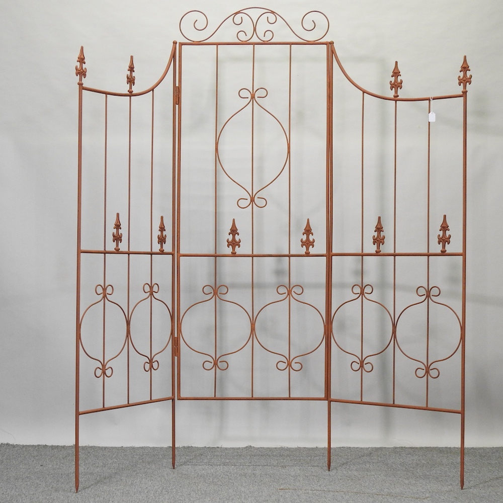 A folding three panel garden screen,