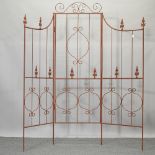 A folding three panel garden screen,