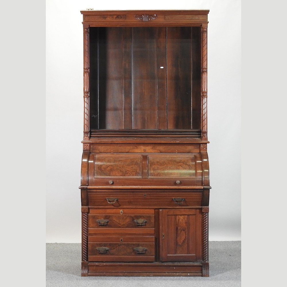 A reproduction walnut roll top bureau bookcase,