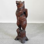 A Black Forest style carving of a bear,