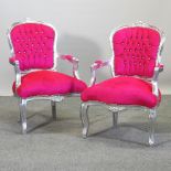 A pair of pink upholstered show frame armchairs