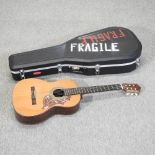 A Spanish acoustic guitar, bearing a label for Archangel,