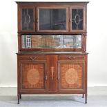 An Edwardian mahogany cabinet, with a glazed upper section,