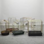 A collection of five metal bird cages