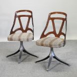 A pair of 1960's lucite and chrome swivel desk chairs