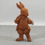 A rusted cast iron figure of Mr Rabbit,