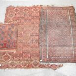 A woollen rug with geometric designs, on a red ground, 220 x 193cm,