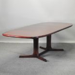 A mid 20th century Scandinavian hardwood extending dining table, with two additional leaves,