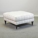 A John Lewis footstool, with cream and blue striped upholstery,