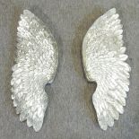 A pair of silver painted angel wings,