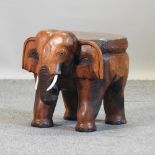 A hardwood occasional table, in the form of an elephant,