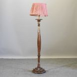 A giltwood standard lamp and shade,