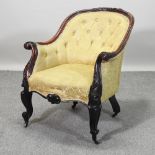 A Victorian yellow upholstered and carved tub armchair