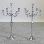 A pair of plated table candelabra,