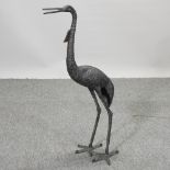 A metal garden model of a crane,