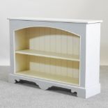 A grey painted dwarf open bookcase,