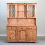 A modern pine dresser, with a glazed top,