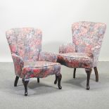 A pair of floral upholstered armchairs,