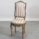 A 19th century French gilt and striped upholstered side chair