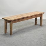 A hand made rustic pine bench, on square tapered legs,