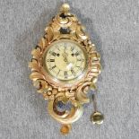 A gilt Cartel style wall clock,