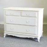 A French style white painted chest, containing two short over two long drawers,