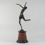 An Art Deco style bronze model of a dancing girl, on a marble base,