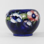 A Moorcroft pottery blue glazed vase, of ovoid shape, signed to base,