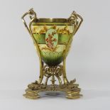 A late 19th century faience oil lamp base, decorated with flowers, probably Doulton,