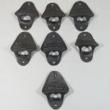A collection of seven vintage style wall mounted bottle openers