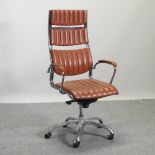 A modern brown ribbed upholstered swivel desk chair