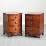 A pair of modern cherrywood bow front bedside chests,