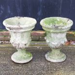 A pair of reconstituted stone garden planters,