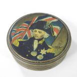 An early 20th century painted tin snuff box, of circular shape, decorated with the figure of Nelson,