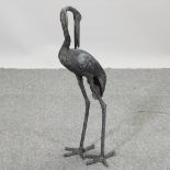 A metal figure of a crane,
