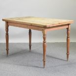 An antique pine kitchen table,