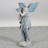 A metal garden figure of a fairy,