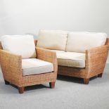 A rattan sofa, with loose cushions, 162cm,