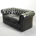 A modern green leather upholstered button back chesterfield sofa,