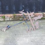 A black painted metal weather vane,