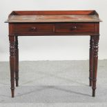 A Victorian mahogany washstand, with two drawers, on turned legs,