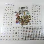 A collection of coins and cigarette cards