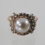 A ladies pearl cluster ring, set with graduated rows of pearls,