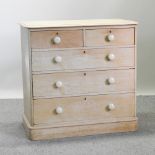 An antique pine limed chest of drawers, 105cm,