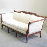 A Georgian style cream upholstered sofa, on cabriole legs,