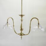 A brass double ceiling light, with cut glass shades,