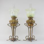 A pair of Arts and Crafts brass oil lamps, in the manner of WAS Benson,