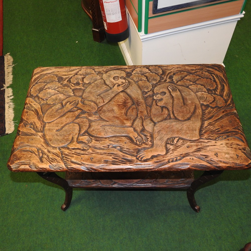 Three Monkey Table An Arts and Crafts carved 'Three Wise Monkeys' centre table, imported ...