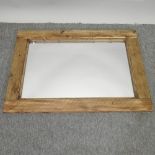 A rustic pine framed wall mirror,